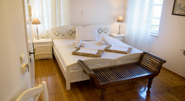 Private room in renovated Venetian building with one double and two single beds. Chania, Greece Ontas | Room with balcony and garden view Room in hotel vacation rental 14816086
