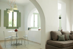 Minimal décor, branded furniture and lighting, traditional arches which act as d  Pylaias' House Entire serviced apartment vacation rental 32095909