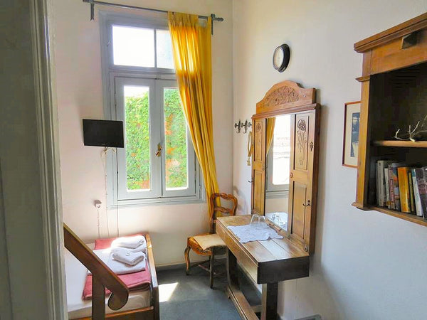 This cozy room is one of the 8 rooms of a  700 year old building with a Venetian Greece Airy and sunny room with view at Chania old harbor Room in boutique hotel vacation rental 27250413