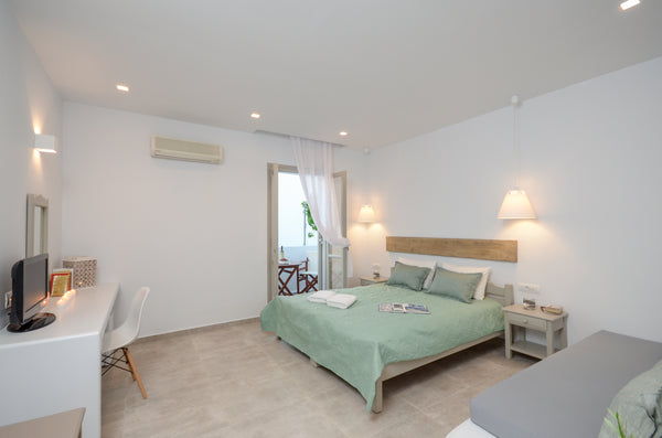 This room, is more spacious than a superior room and is decorated with Cycladic   Deluxe triple room Room in boutique hotel vacation rental 48191363