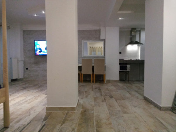 This is an apartment in one of the main streets of the city, the 