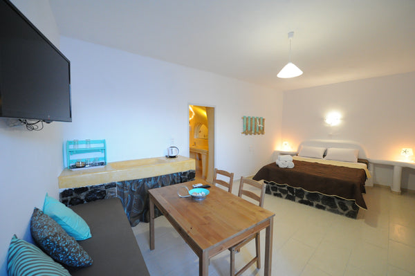 Standard Double Room, decorated in white hues, accommodates up to 3 adult guests Fira, Greece Manias Residences | Standard Double Room [30 m²] Entire rental unit vacation rental 7866083