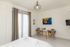 This brand new studio apartment has a balcony to our fun and colorful street, an Tel Aviv-Yafo, Tel Aviv District, Israel Balcony fully suited Studio Apartment in Psyri #2 Entire rental unit vacation rental 30917113