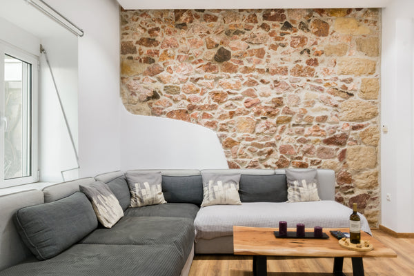 Recline on an expansive, plush sectional sofa beside a showcase cut-out exposed  Syros, Greece Luxury Apartment near the Acropolis Entire rental unit vacation rental 18723334