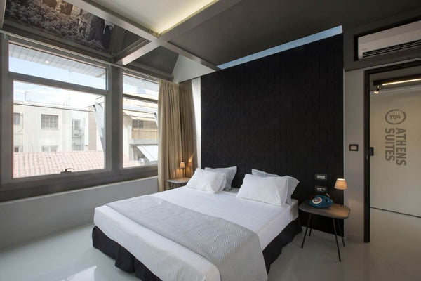 The room has large, floor to ceiling windows overlooking the quiet Fokianou Stre GR Deluxe Double Room Private room in bed and breakfast vacation rental 21105710