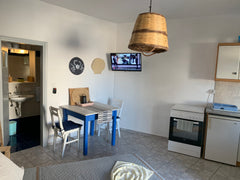 The studio consist of a small fridge convection cooker, air condition, wifi, own London, United Kingdom 1 BEACH STUDIO W KITCHEN SECONDS FROM THE SEA Cycladic home vacation rental 17447117