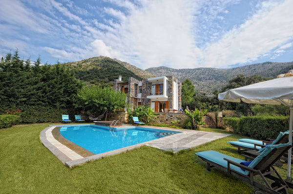 This property is a 15-minute walk from the beach. Showcasing a barbecue and sun  Heraklion, Greece Manolioudis Villas, Private Villa, Private Pool Entire villa vacation rental 21985827