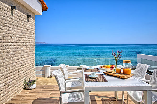 Relax on the terrace overlooking the crashing waves at a bright, stylish villa r Heraklion, Greece Seashell, an Elegant Seafront Villa Entire villa vacation rental 24535005
