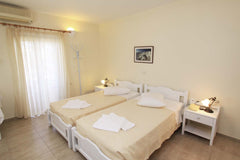 Measuring 22 square meters, this room opens to a private balcony!. Get a good ni Fira, Greece Ersi villas-Cozy Triple room with private balcony! Room in hotel vacation rental 5915130