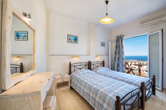 Our unique family room includes:<br />One room with one double bed<br />One room Thira, Greece Family Room with Balcony Room in serviced apartment vacation rental 31972582