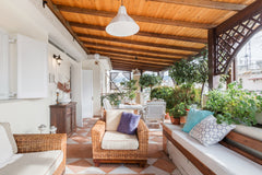 Dine on the verdant covered front terrace of this centrally located apartment. T Athens, Greece Joy Apartment / Green, Spacious, Grand View Entire rental unit vacation rental 30261466