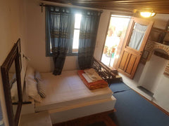 This spacious room is one of the 8 rooms of a  700 year old building with a Vene Greece Room at the breeze of  Chania old harbor Room in boutique hotel vacation rental 27265415