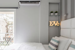 Awaken in a comfy white bed as morning light streams in through floor-to-ceiling Notios Tomeas Athinon, Greece Walk to Markets and Museums from a Cozy Studio Entire rental unit vacation rental 21794188