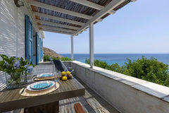 The residence is set near the village of Stenies, a short drive from the main An Athens, Greece The White House by the beach Cycladic home vacation rental 50842118