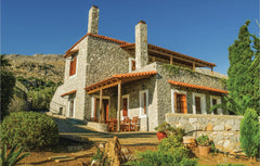 This charming villa, situated on a hill and open to a beautiful view of the Libi  Awesome home in Agios Vasilios with 5 Bedrooms Entire home vacation rental 21340499