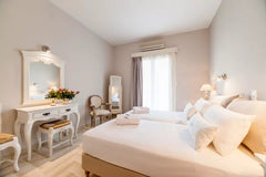 This traditionally decorated room features comfort mattresses, soundproofed door  Anna Platanou Superior Triple Room Room in hotel vacation rental 28505358