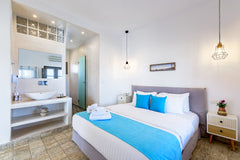 This suite is on ground floor, modern, has living room 12sqm with sofa and two l Thera, Greece Deluxe Suite with Sea View (2 pax) Private room in rental unit vacation rental 24395279