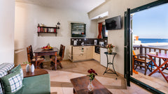 Situated directly on the sea, on a rocky seashore, in the small fishing village  Sisi, Greece Porto Sisi Suite with Sea View Room in serviced apartment vacation rental 34375541