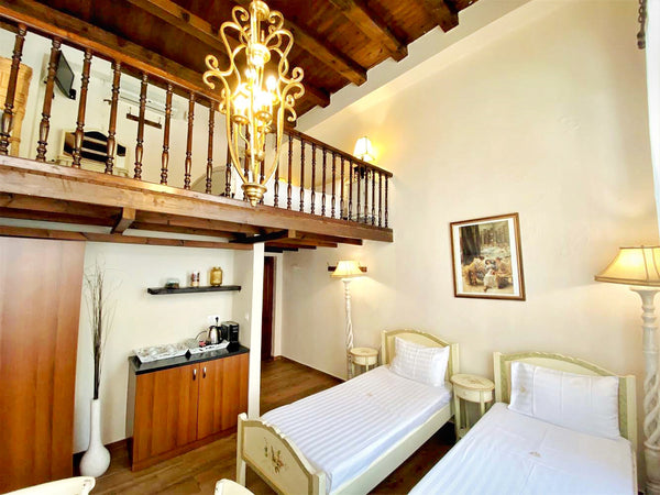Spacious and bright room in 2 levels. There are 2 single beds on the ground floo Chania, Greece Family Room- Split Level | Chania Old Town Room in boutique hotel vacation rental 31997473