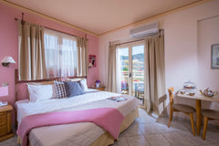 The room features two bedrooms which offer a sense of privacy to all the guests. Malia beach, Greece Deluxe Family Room (5 persons)Shared Pool +BB Opposite of Central Beach of Malia Room in hotel vacation rental 21149781
