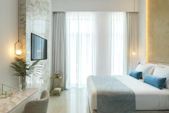 The Sapphire suite consists of a king-size bed and a sofa that can accommodate a Chania, Greece Sapphire Suite - Mirabile Luxury Suites Room in boutique hotel vacation rental 44719623