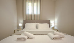 A room with two bedrooms, located on the ground floor. The first bedroom has a d Chania, Greece Village Drapanias Entire rental unit vacation rental 14553569