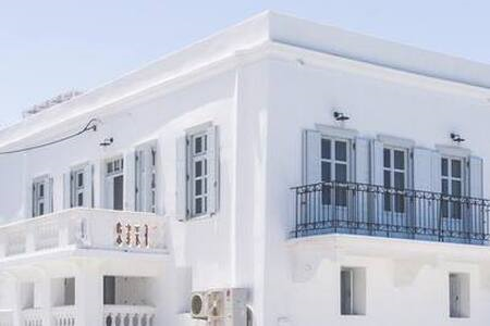One Manto Square is a classical mansion house set over 2 floors.The iconic build  One Manto Square Deluxe House Cycladic home vacation rental 36401071