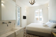 Enjoy a stylish experience at tA fully renovated old Athenian building in to a m GR Plues Suites Athens / E Entire rental unit vacation rental 604038827932670121