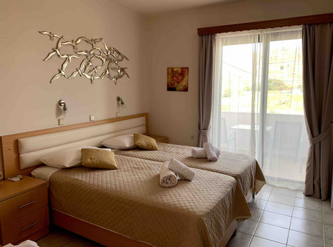 Situated above  DAVINCIS Restaurant 50 metres from the beach,the room has a TV,  Charaki, Greece Davinci’s rooms Private room in home vacation rental 581014008442749543