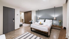 Our luxurious suite has a spacious and comfortable open plan bedroom with a Quee GR Superior Suite City View Room in aparthotel vacation rental 43484889