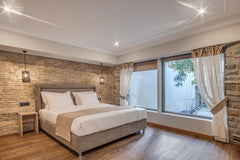 This suite is a two-level family suite with a super king-size double bed, a spac GR Philia Btq Hotel Two Level Family Suite, terrace Private room in bed and breakfast vacation rental 50409796
