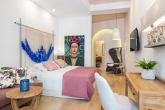 Inspired by Frida’s Kahlo painting and by the shadowy armchair M’Afrique by Moro Chania, Greece Aisha Petite Suites - Frida Suite Private room in rental unit vacation rental 49186241