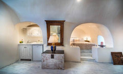 An open-plan suite with a cave bedroom,kitchenette, an antique dining room and a  Heliophos Family Suite Entire loft vacation rental 21603098