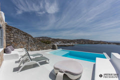 South located house, elegant infinity pool surrounded by summer furniture and so London, United Kingdom VillaAqua-Luxury&SeaviewPsarou ESL1173K132K0918601 Cycladic home vacation rental 6344857