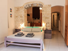 It is a unique stone house with a beautiful spacious yard full of colorful  flow Ermoupoli, Greece Stone house with a yard Entire rental unit vacation rental 12947058