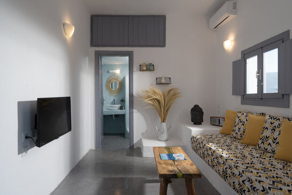 A cosy modern complex of suites with the traditional island style that suits the Greece Blue White Suites 