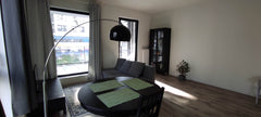 I offer a nice bright studio (living room with a kitchen) in a new building.<br  Brussels, Belgium Living room with a terrace Private room in condo vacation rental 52167573